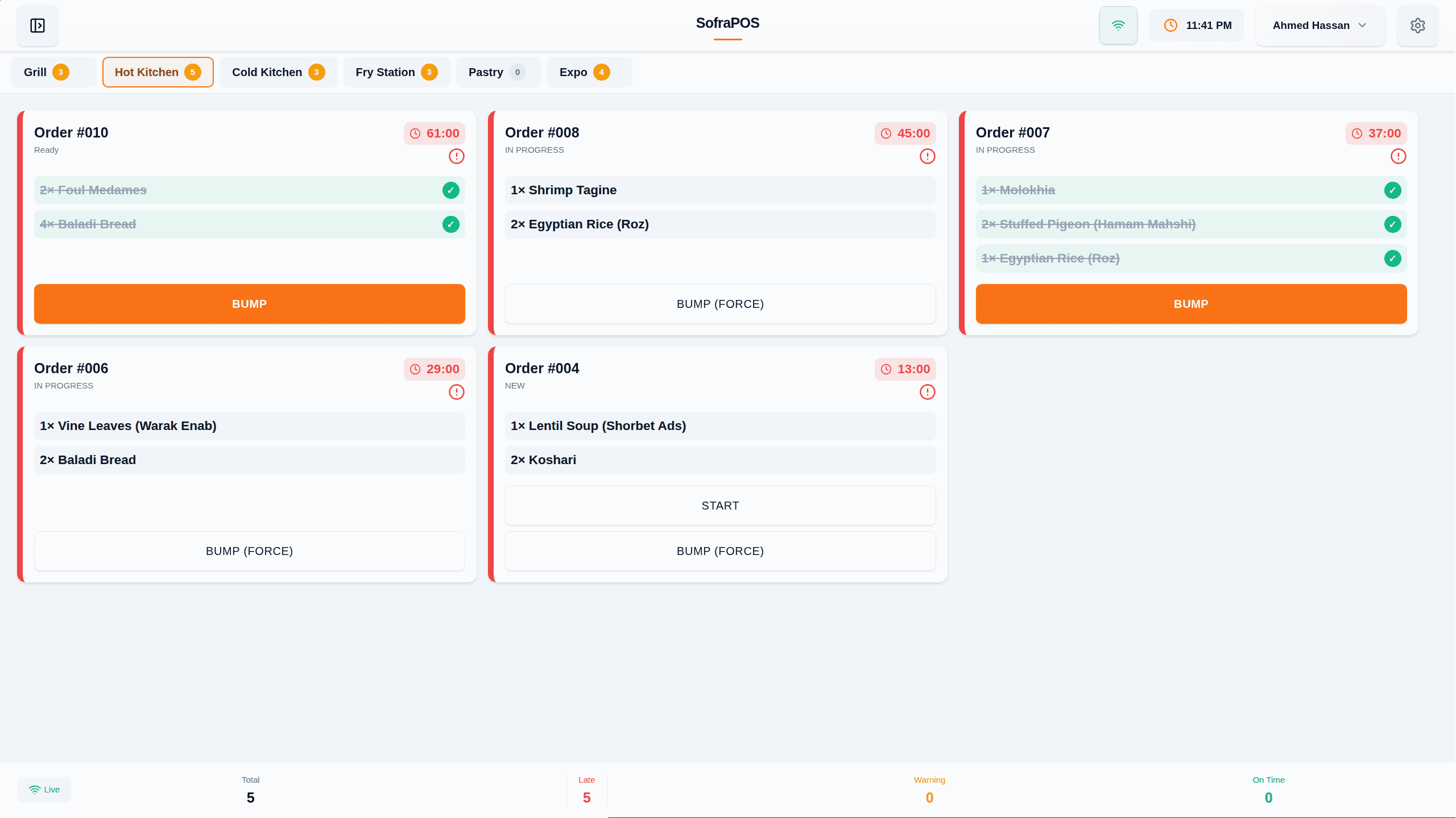 The Kitchen Display System — orders routed to stations and bumped in real time.
